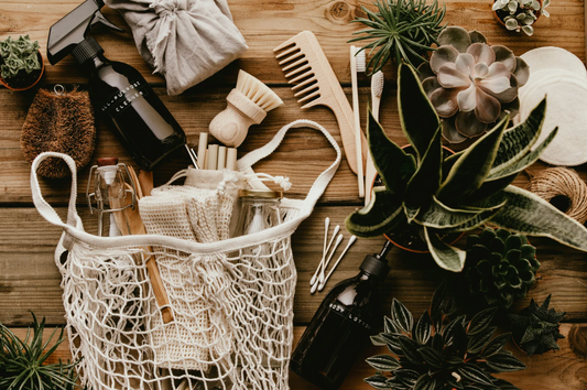 Mesh bag filled with refillable containers and eco-friendly everyday essentials