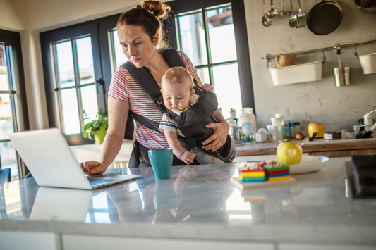 busy mom in kitchen with baby